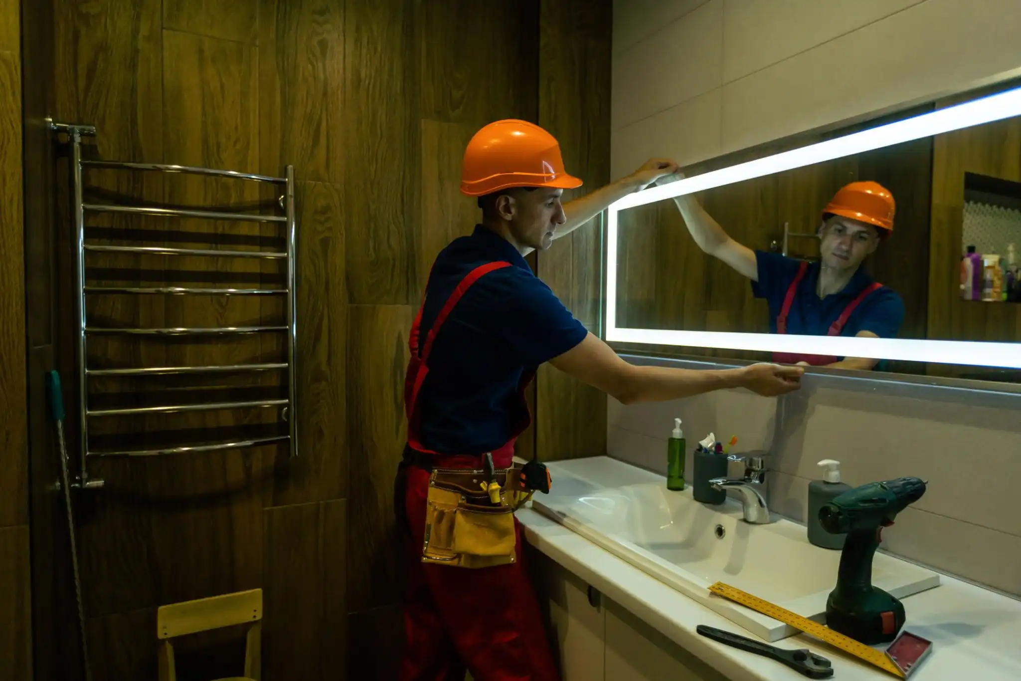 Bathroom lighting and mirror installation designed to improve visibility, functionality, and modern bathroom style