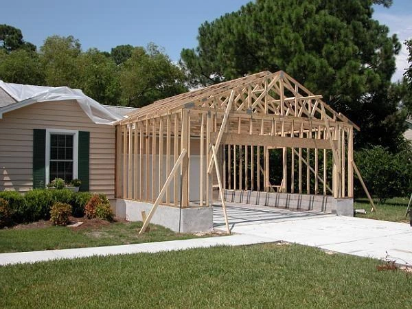 Construction garage additions designed to expand storage, protect vehicles, and increase the functionality and value of your home